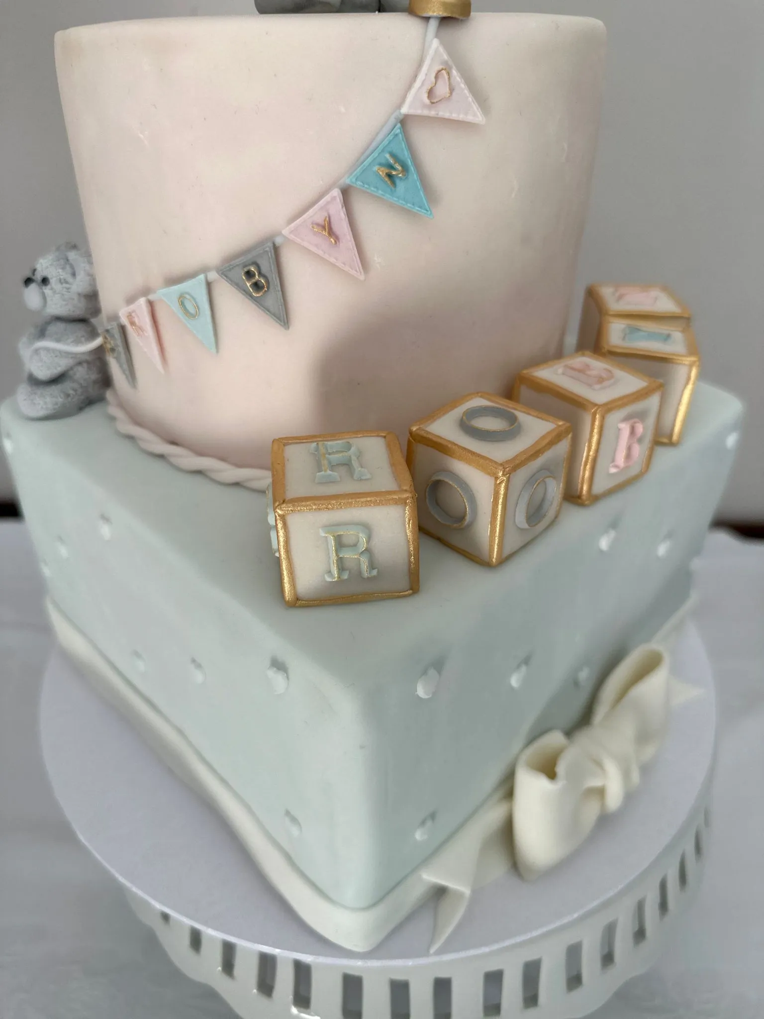 Christening cake with bunting decoration and alphabet blocks
